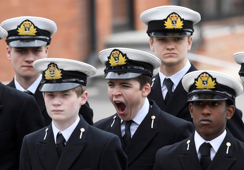 <p>A pupil yawns as he waits for Britain’s Queen Elizabeth and Prince Philip to visit the Pangbourne College near Reading, May 9, 2017. (Photo: Toby Melville/Reuters) </p>