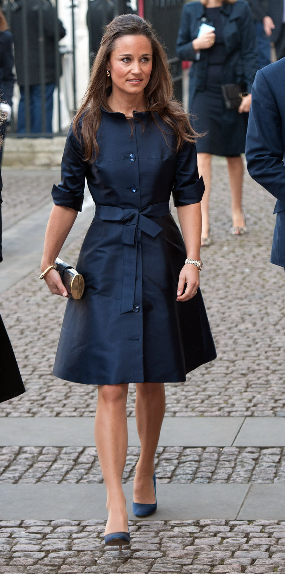 <p>This belted, navy blue Suzannah shirt dress was the perfect pick for Sir David Frost’s memorial service in early 2014. <i>[Photo: PA Images]</i> </p>