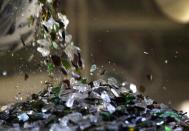 Bits of glass move along a conveyor belt inside Strategic Materials, Inc. in Wilson, N.C. on Wednesday, Jan. 18, 2023.