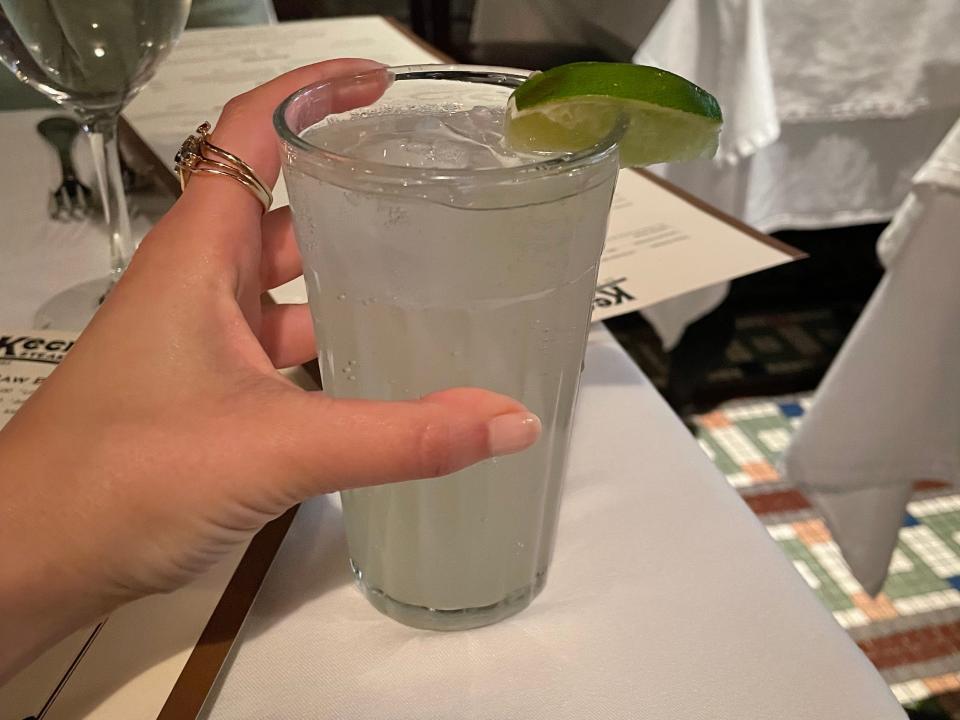 Author Rachel Askinasi holding a ginger ale 