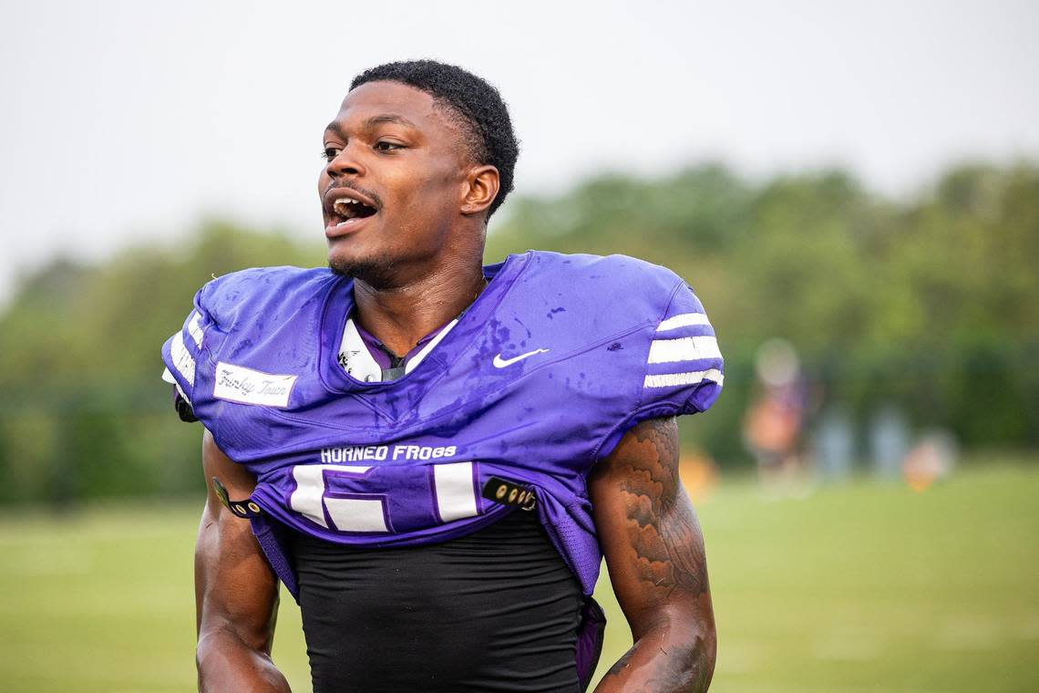 TCU safety Bud Clark (21) comes to the sideline after a scrimmage during a spring practice at the Sheridan & Clif Morris Football Practice Fields in Fort Worth on Wednesday. Clark is balancing fatherhood with playing college football and attending classes.