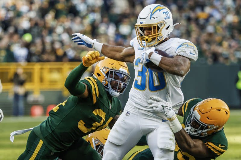 Los Angeles Chargers running back Austin Ekeler (C) tries to get away from Green Bay Packers defenders on Sunday at Lambeau Field in Green Bay, Wis. Photo by Tannen Maury/UPI