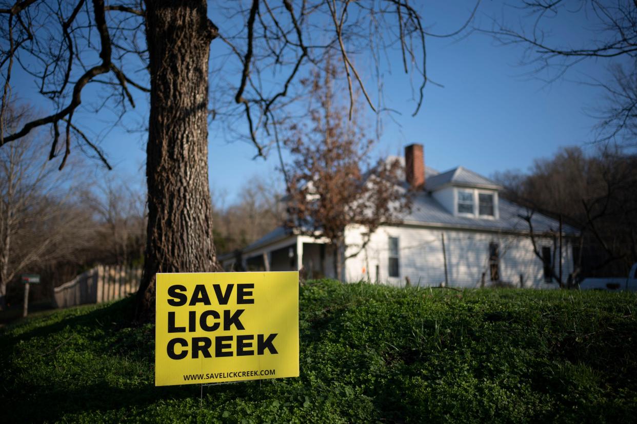 A sign reading "Save Lick Creek" rests outside a home along Beech Valley Rd. Friday, Dec. 16, 2022 in Primm Springs, Tenn. Hickman County residents are concerned about a proposed plan for the Water Authority of Dickson County to build a wastewater treatment facility in eastern Hickman County that would dump treated wastewater into Lick Creek.