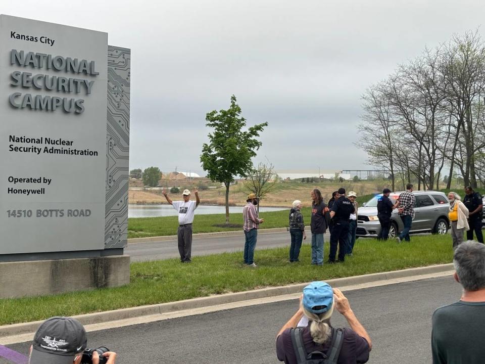 Protesters gather outside the entrance to the National Nuclear Security Administration’s plant in south Kansas City on Monday, April 15, 2024. Police and security officers handcuffed at least 10 people who either ventured onto the expansion site or onto the plant’s land.