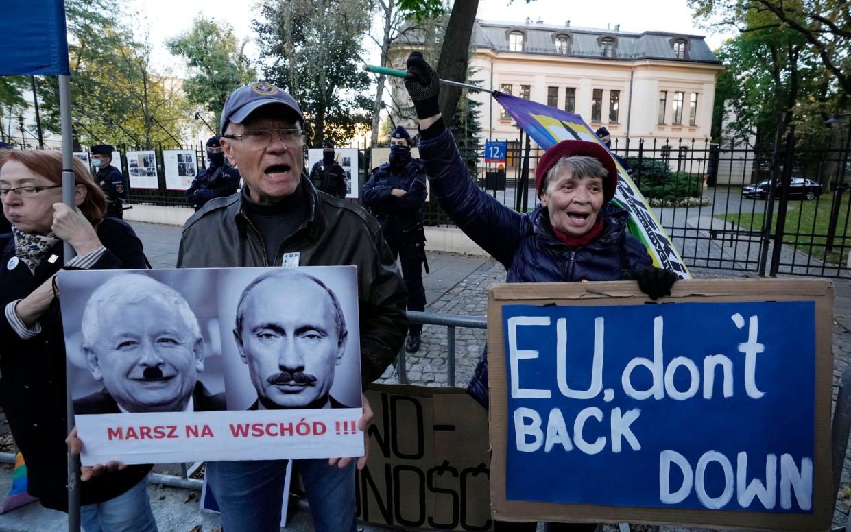 People stage a protest in front of Poland's constitutional court - Getty