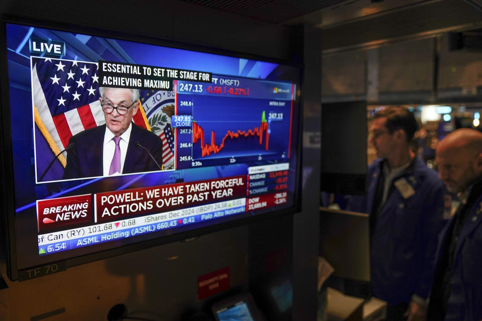 File - Traders on the floor at the New York Stock Exchange watch Federal Reserve Chair Jerome Powell's news conference after the Federal Reserve interest rate announcement in New York, Wednesday, Feb. 1, 2023. Some economists expect the Fed to raise its benchmark rate by a substantial half-percentage point when it next meets March 21-22 after announcing only a quarter-point hike when it met Jan. 31-Feb. 1. (AP Photo/Seth Wenig, File)