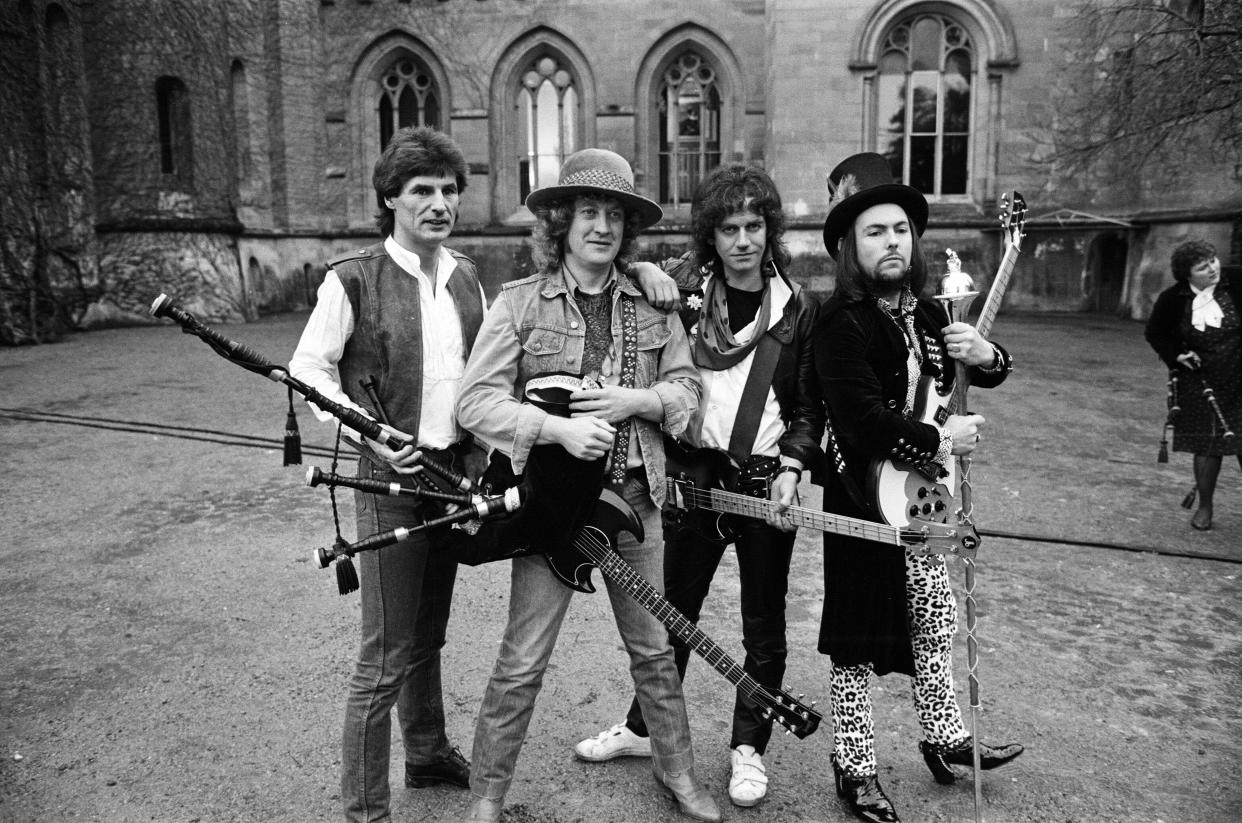 Slade (Don Powell, Noddy Holder, Jim Lea and Dave Hill) filming a new video at Eastnor Castle, near Ledbury, 26th January 1984. (Photo by Birmingham Post and Mail Archive/Mirrorpix/Getty Images)