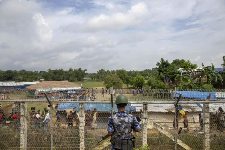 Myanmar police patrol a Rohingya camp on the border with Bangladesh on August 24, 2018