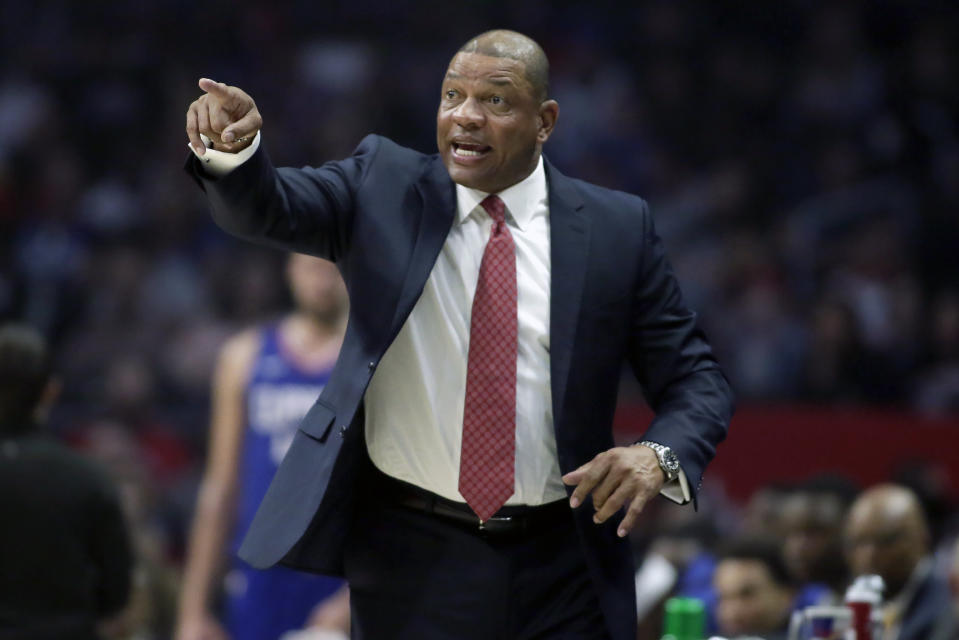 Los Angeles Clippers head coach Doc Rivers talks to his players during the first half of an NBA basketball game against the Minnesota Timberwolves in Los Angeles, Saturday, Feb. 1, 2020. (AP Photo/Alex Gallardo)