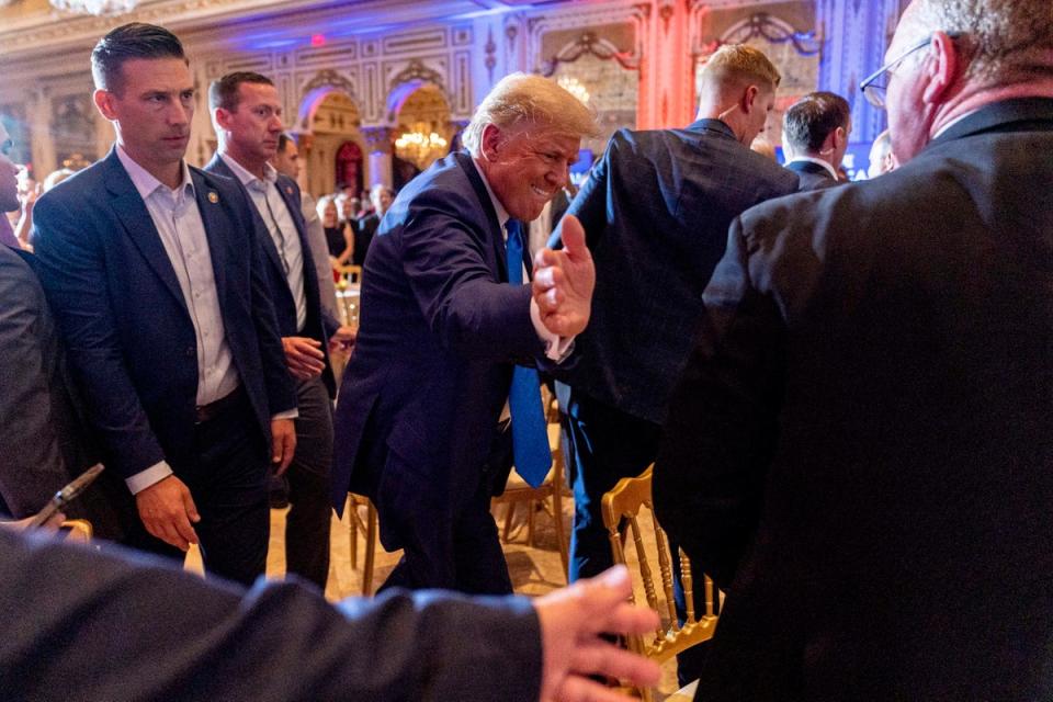 Former President Donald Trump greats guests at Mar-a-lago on the day of the 2022 midterm elections (AP)
