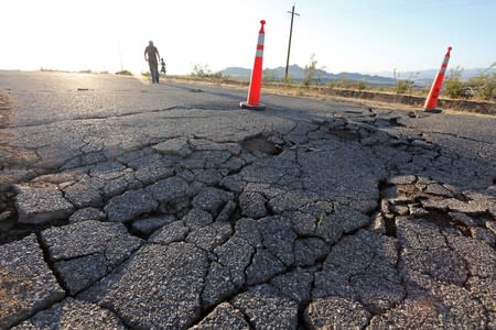 Fissures that opened up under a highway during a powerful earthquake that struck Southern California are seen near the city of Ridgecrest