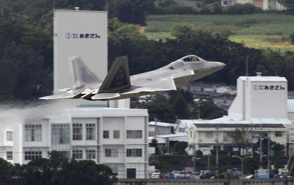 In this Aug. 14, 2012 photo, a U.S. Air Force F-22 Raptor takes off from Kadena Air Base on the southern island of Okinawa, in Japan. The deployment of a dozen F-22 stealth fighters to Japan has so far gone off without a hitch as the aircraft are being brought back into the skies in their first overseas mission since restrictions were imposed over incidents involving pilots getting dizzy and disoriented, a senior U.S. Air Force commander told the Associated Press on Thursday, Aug. 30, 2012. (AP Photo/Greg Baker)