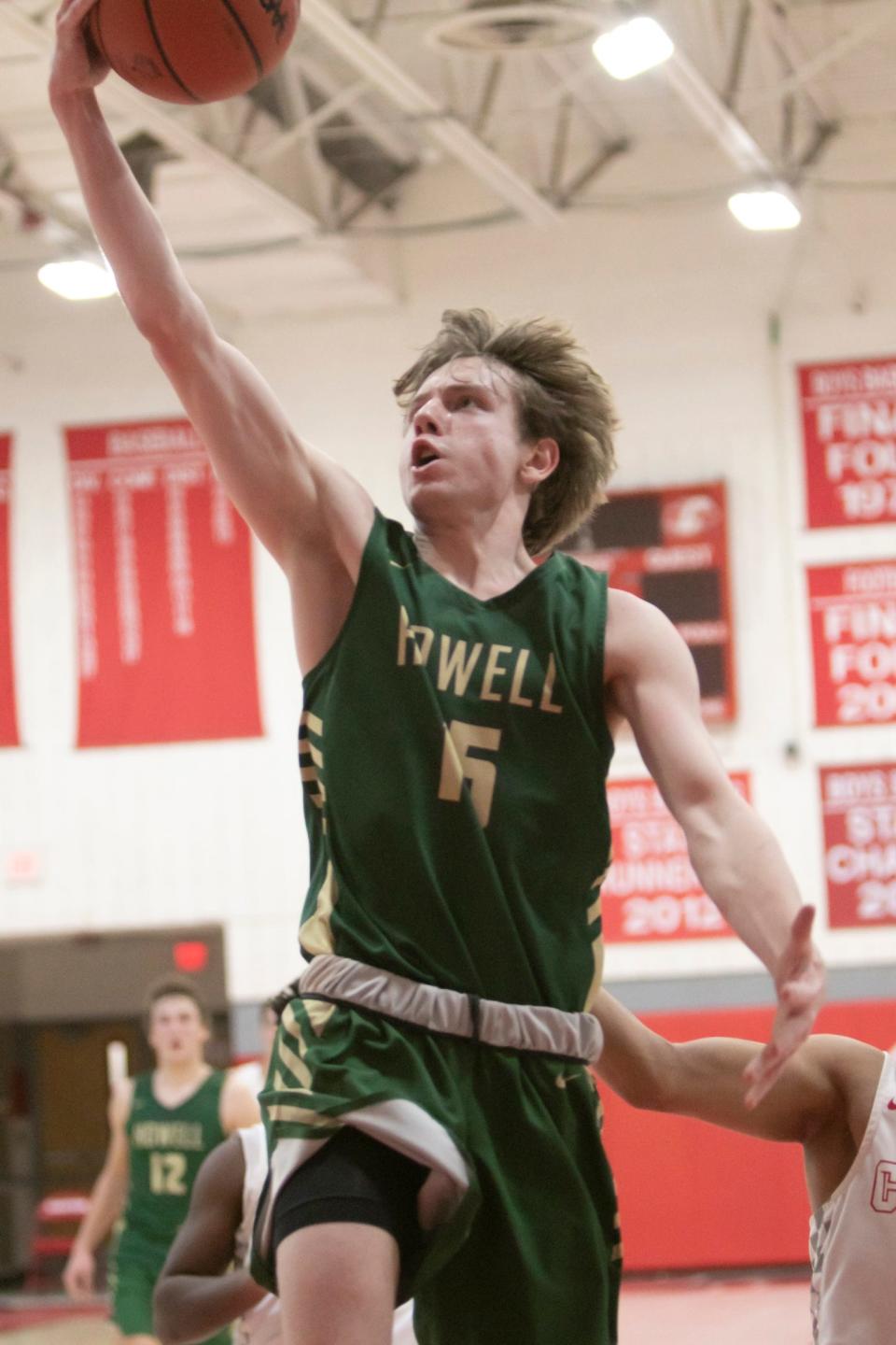 Howell's Adam Jones drives for two of his 10 points in a 52-45 loss to Canton on Tuesday, Jan. 25, 2022.