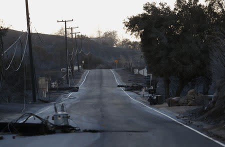 Downed power lines and debris are seen along Mulholland Highway in the aftermath of the Woolsey fire in Malibu, Southern California, U.S. November 11, 2018. REUTERS/Mario Anzuoni