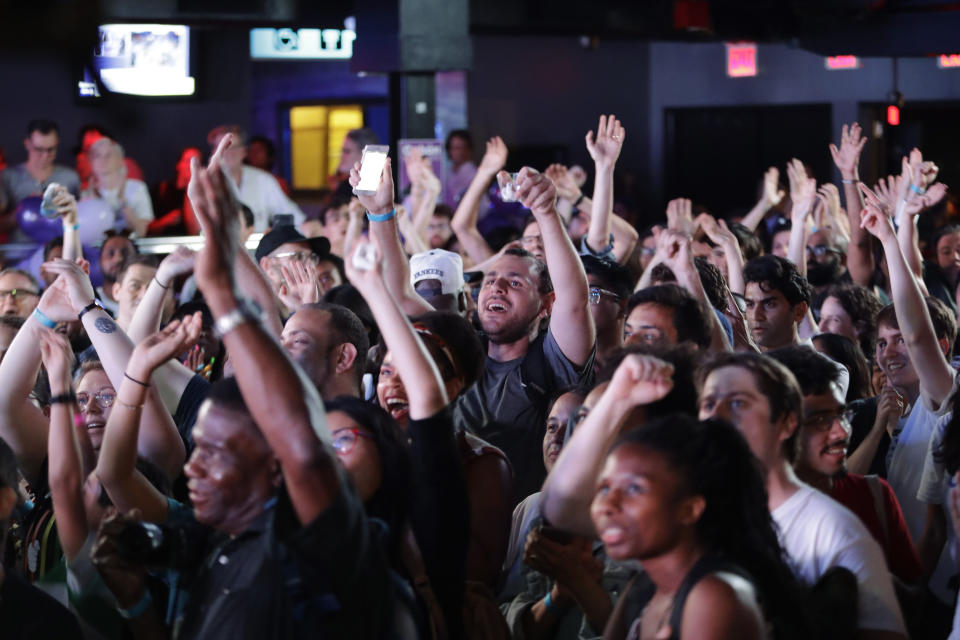 Supporters react to the poll results as they gather at the campaign headquarters of Queens district attorney candidate Tiffany Caban Tuesday, June 25, 2019, in the Queens borough of New York. (AP Photo/Frank Franklin II)