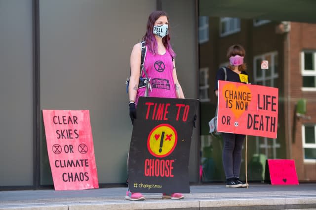 Extinction Rebellion activists stage a socially distanced protest outside the Woolwich Centre in south London