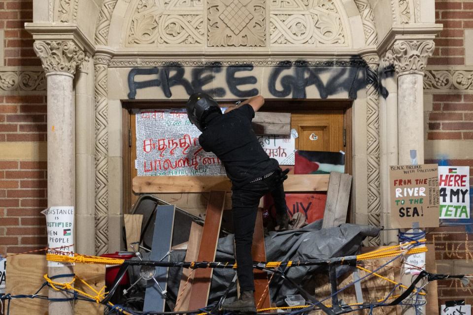 Demonstrators occupy a Pro-Palestinian encampment at UCLA as authorities breach and break up the encampment.