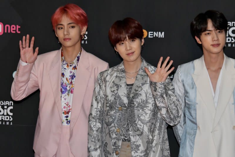 BTS members, from left to right, V, Suga and Jin, pose for camera during the red carpet ceremony for MAMA Fan's Choice in Japan in Saitama, Japan, in 2018. File Photo by Keizo Mori/UPI