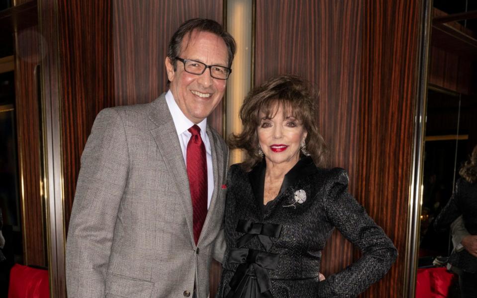 Joan Collins and Percy Gibson - WireImage/Ki Price