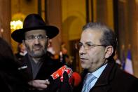 France's Grand Rabbi Bernheim and Mohamed Moussaoui, President of the French Muslim Council speak with the media as they leave after attending the New Year's speech by France's President Sarkozy at the Elysee Palace in Paris