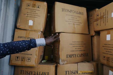 An agent shows illegal and false drugs seized by Ivorian authorities in Abidjan, Ivory Coast November 6, 2018. Picture taken November 8, 2018. REUTERS/Luc Gnago