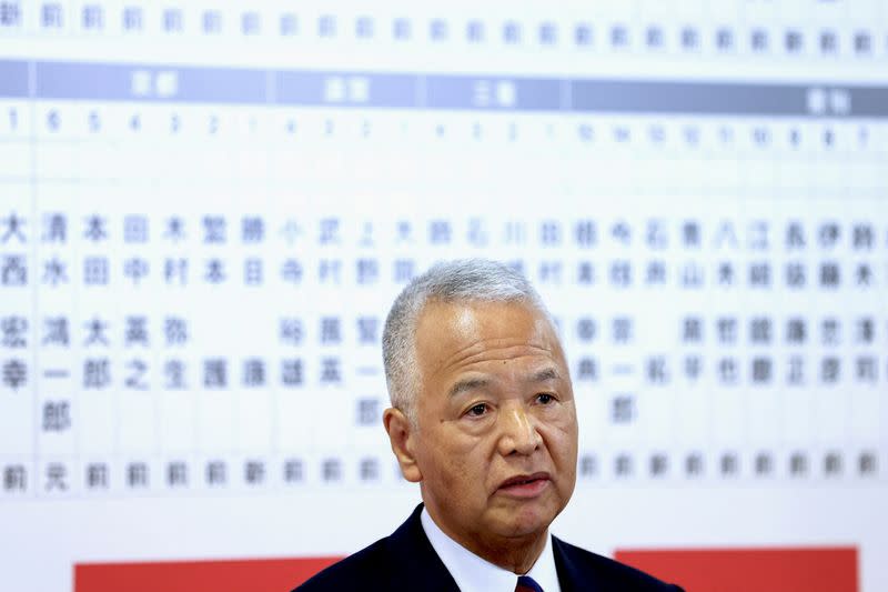 FILE PHOTO: Japan's ruling Liberal Democratic Party (LDP) General Secretary Akira Amari attends the Party's announcement for successful general election candidates event at the party headquarters, in Tokyo