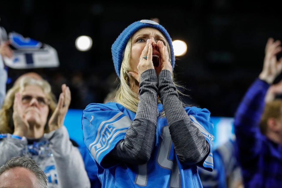 Detroit Lions fans cheer for the Lions against the L.A. Rams during the second half of the NFL wild-card playoff game at Ford Field in Detroit on Sunday, Jan, 14, 2024.