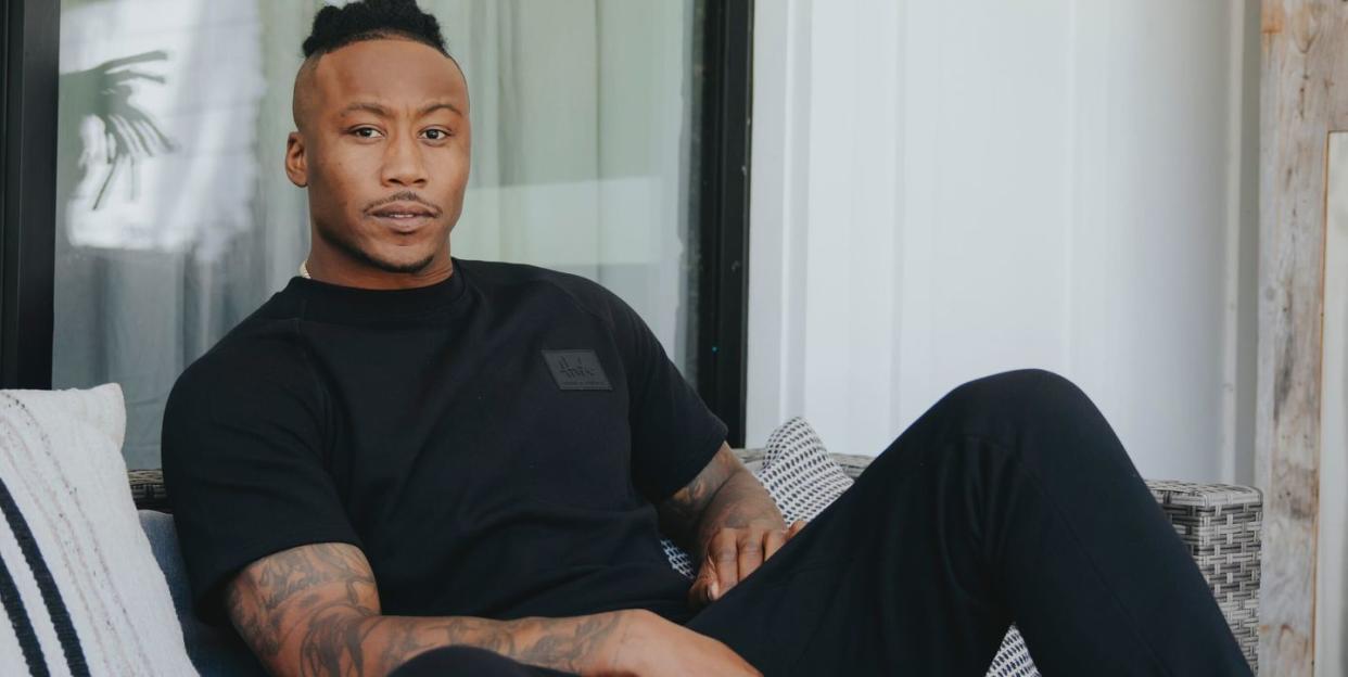 brandon marshall casually sitting on a sofa