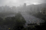 Protesters gather on Victoria Park in Hong Kong Sunday, Aug. 18, 2019. Thousands of people streamed into the park for what organizers hope will be a peaceful demonstration for democracy in the semi-autonomous Chinese territory. (AP Photo/Kin Cheung)