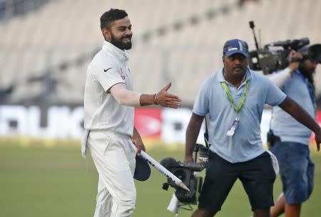 Cricket - India v New Zealand - Second Test cricket match - Eden Gardens, Kolkata, India - 03/10/2016. India's captain Virat Kohli celebrates after winning the match. REUTERS/Rupak De Chowdhuri