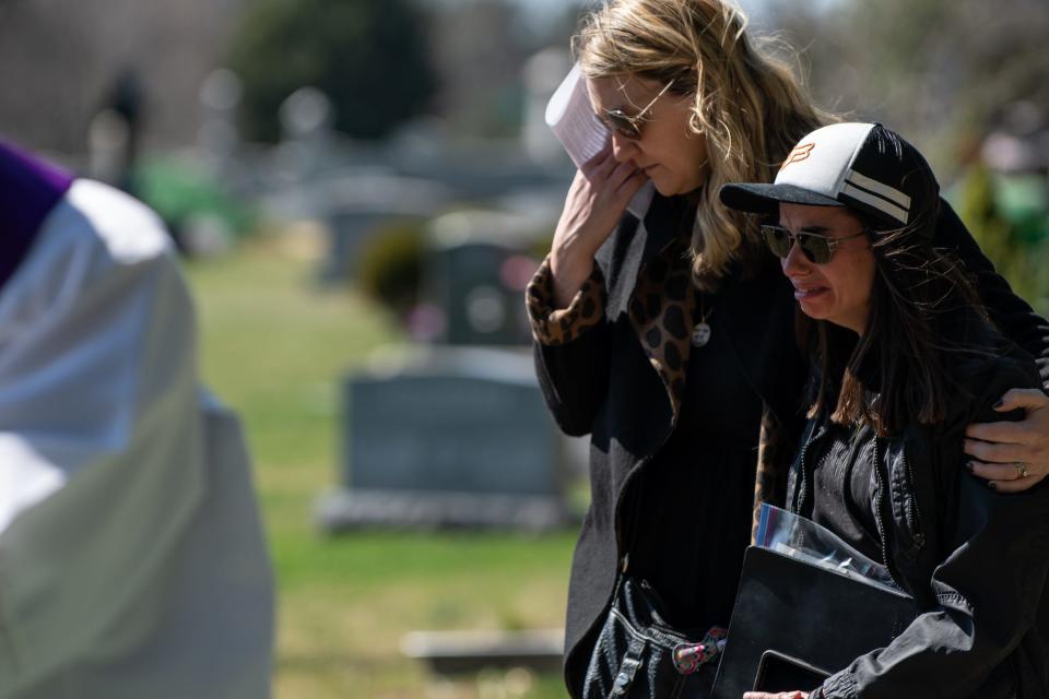 Jill Ostenhout, left, comforts Anya Delli Gatti, the mother of Diana Josephine Delli Gatti, one of the 12 unclaimed fetal remains, at Union Cemetery in Richboro on Tuesday, March 30, 2021.