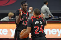 Toronto Raptors forward Pascal Siakam (43) celebrates with guard Norman Powell (24) after the team defeated the Philadelphia 76ers during an NBA basketball game Sunday, Feb. 21, 2021, in Tampa, Fla. (AP Photo/Chris O'Meara)