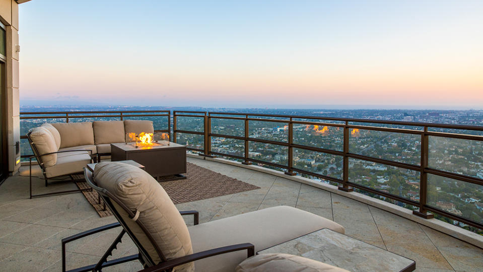 A terrace with firepit - Credit: Photo: Anthony Barcelo/Compass