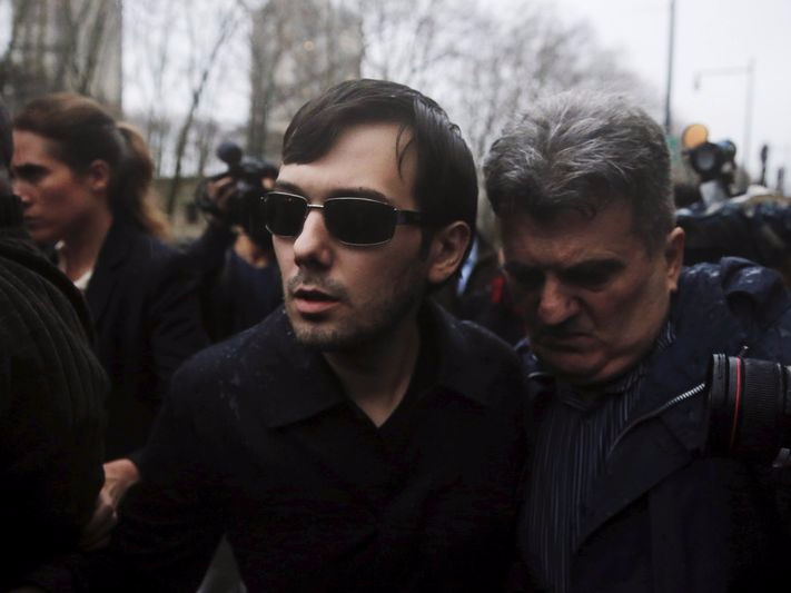 Martin Shkreli (C), chief executive officer of Turing Pharmaceuticals and KaloBios Pharmaceuticals Inc, departs U.S. Federal Court after an arraignment following his being charged in a federal indictment filed in Brooklyn relating to his management of hedge fund MSMB Capital Management and biopharmaceutical company Retrophin Inc. in New York in this December 17, 2015, file photo. REUTERS/Lucas Jackson/Files 