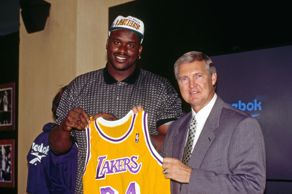 Shaq poses with Lakers GM Jerry West the day after signing. (Andrew D. Bernstein/NBAE via Getty Images)