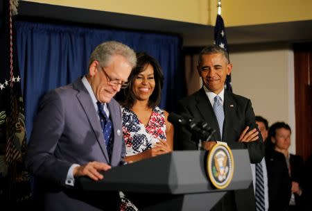 U.S. President Barack Obama and his wife Michelle stand with U.S. ambassador to Cuba, Jeffrey DeLaurentis (L), as they meet with embassy staff in a hotel in Havana March 20, 2016. REUTERS/Carlos Barria/File Photo