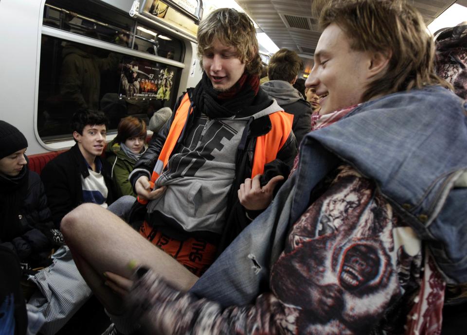 A passenger without his pants rides a subway train during the "No Pants Subway Ride" event in Warsaw