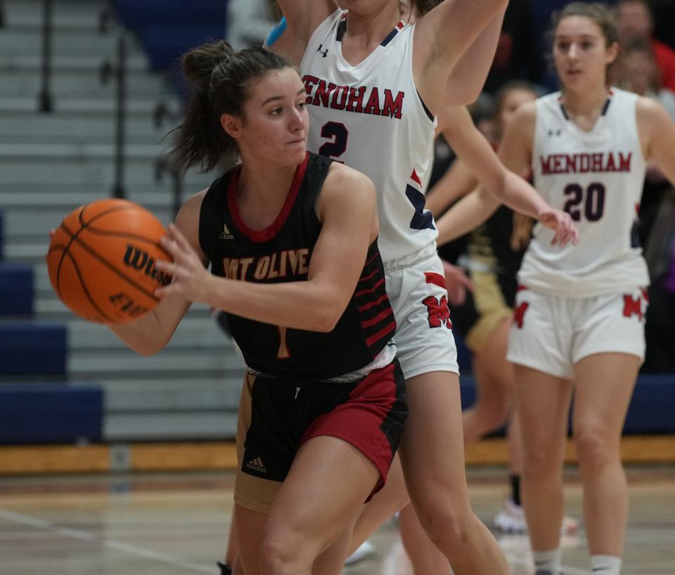 Bella Cefalo of Mt. Olive is guarded by Halle Ferrara of Mendham in the second half as Mendham defeated Mt. Olive 34-23 in an NJAC-National girls basketball game played in Mendham, NJ on January 11, 2023.