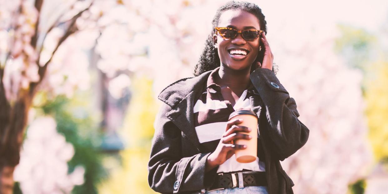 a woman wearing sunglasses and a suit