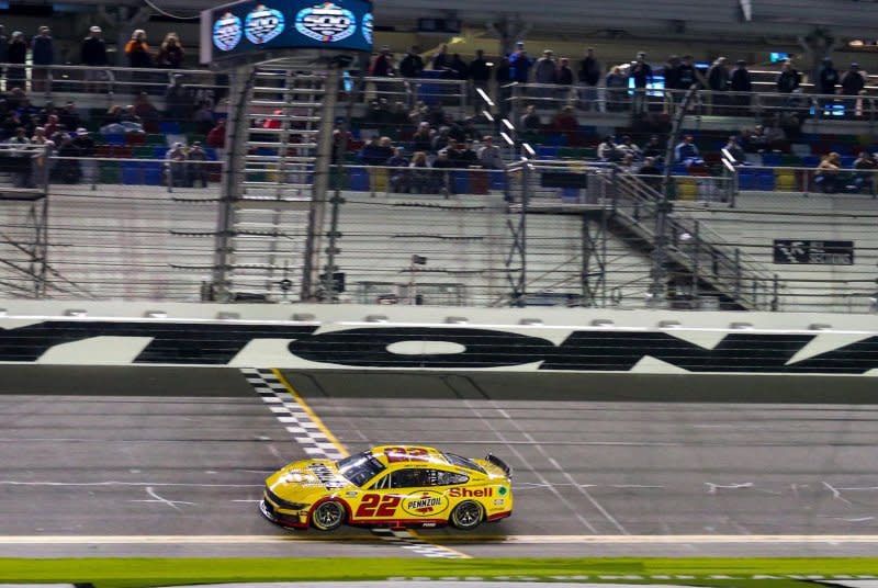 Joey Logano crosses the finish line to take the pole for the 66th Daytona 500 on Wednesday in Daytona Beach, Fla. Photo by Mike Gentry/UPI