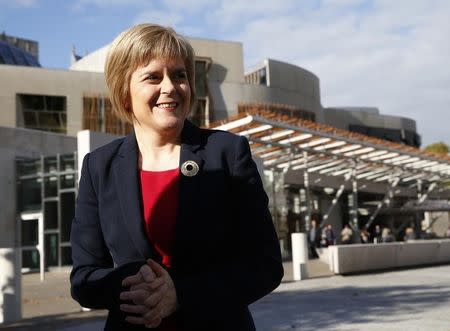 Nicola Sturgeon speaks to the media outside the Scottish Parliament in Edinburgh, Scotland October 15, 2014. REUTERS/Russell Cheyne