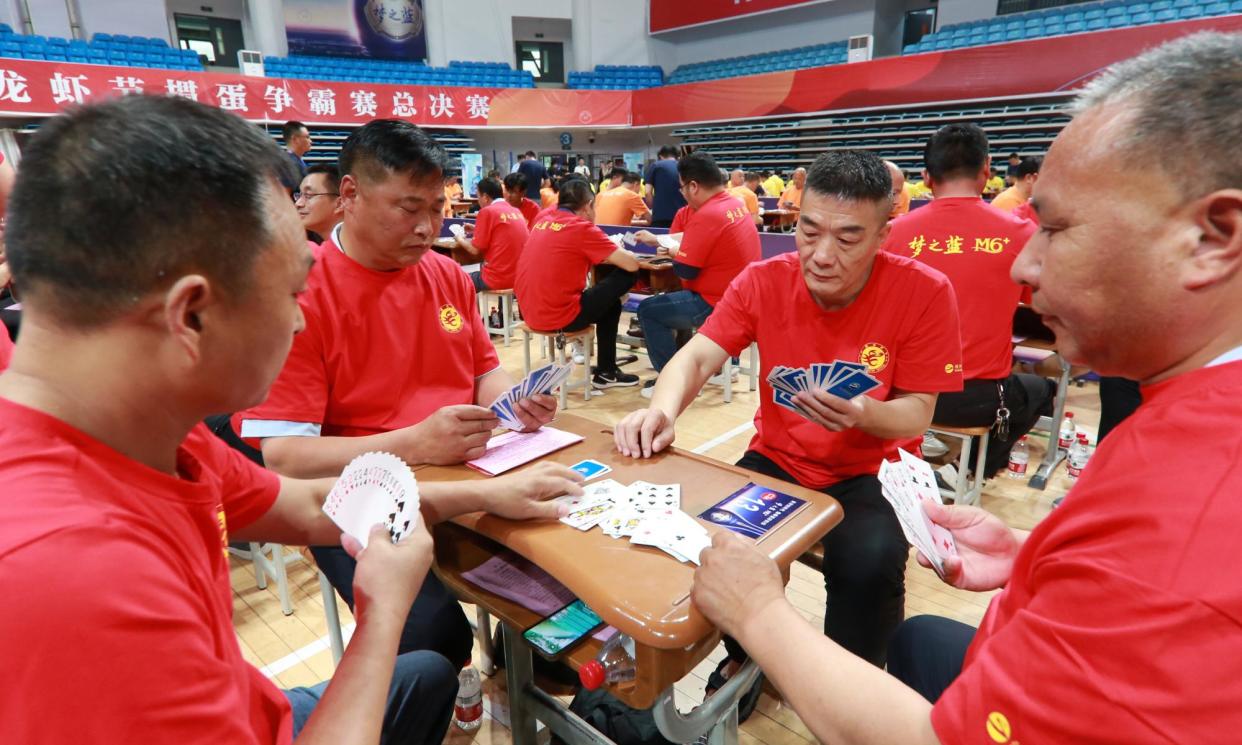 <span>Players in a tournament in Huaian City.</span><span>Photograph: NurPhoto/Getty Images</span>