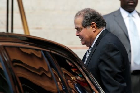 U.S. Supreme Court Justice Antonin Scalia departs following the Red Mass, a service to mark the beginning of this year's Supreme Court term, at the Cathedral of St. Matthew the Apostle in Washington October 5, 2014. REUTERS/Jonathan Ernst