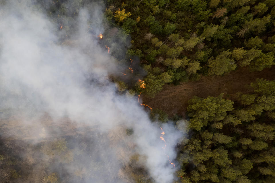Wildfires burn forests near the village of Kirkis, near Alexandroupolis town, in the northeastern Evros region, Greece, Wednesday, Aug. 23, 2023. Water-dropping planes from several European countries joined hundreds of firefighters Wednesday battling wildfires raging for days across Greece that have left 20 people dead, while major blazes were also burning in Spain's Tenerife and in northwestern Turkey near the Greek border. (AP Photo/Achilleas Chiras)