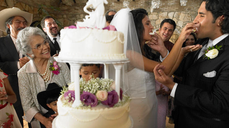 Couple with their wedding cake