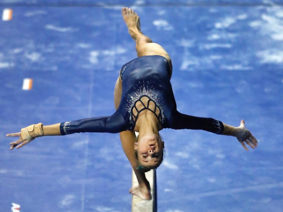 Madison Kocian competes for UCLA on the balance beam.