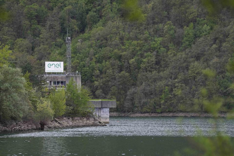 FILE - A view of the Enel Green Power hydroelectric plant at the Suviana Dam, some 70 kilometers southwest of Bologna, Italy, April 10, 2024. Divers have discovered two more bodies of workers who died in an explosion that collapsed and flooded several levels of an underground hydroelectric plant earlier this week, bringing to five the number of confirmed dead, officials said Thursday. (AP Photo/Antonio Calanni, File)