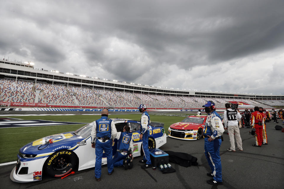 Dark clouds fill the sky over Charlotte Motor Speedway before the start of the NASCAR Cup Series auto race Sunday, May 24, 2020, in Concord, N.C. (AP Photo/Gerry Broome)