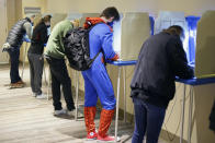 Colin Buckley of Omaha wears a Spiderman suit as he votes early on Halloween, at the Douglas County Election Commision office in Omaha, Neb., Saturday, Oct. 31, 2020. (AP Photo/Nati Harnik)