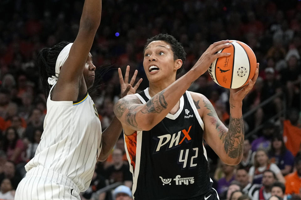 FILE - Phoenix Mercury center Brittney Griner (42) goes up for a shot against Chicago Sky center Elizabeth Williams during a WNBA basketball game May 21, 2023, in Phoenix. Griner’s return to the WNBA after nearly 10 months in a Russian prison hasn’t always been the smoothest ride. There have been injuries. There was a break for mental health. But there have also been many moments of joy. She was welcomed by adoring crowds at nearly every WNBA arena. Individually, she played well, and was selected to play in another All-Star game. (AP Photo/Ross D. Franklin, File)